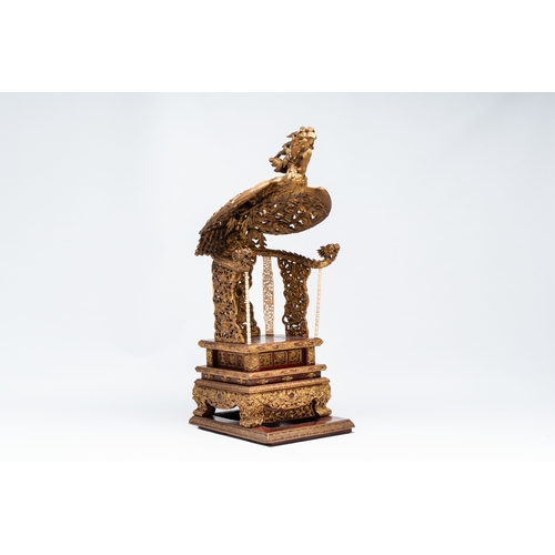 282 - An exceptional Vietnamese gilt-lacquered wood and ivory 'Dragon and Phoenix' throne-shaped altar, 18... 