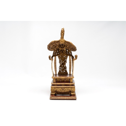 282 - An exceptional Vietnamese gilt-lacquered wood and ivory 'Dragon and Phoenix' throne-shaped altar, 18... 