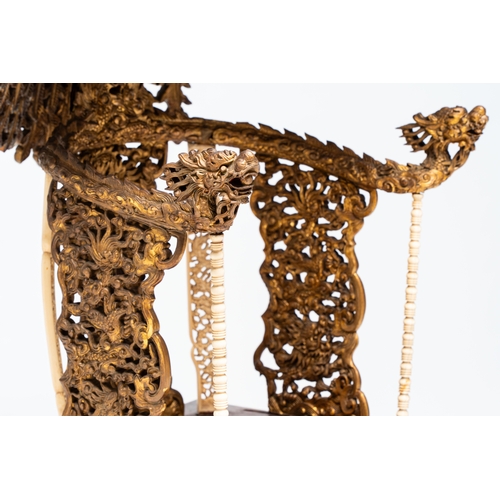 282 - An exceptional Vietnamese gilt-lacquered wood and ivory 'Dragon and Phoenix' throne-shaped altar, 18... 