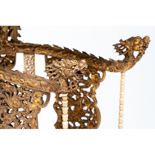 282 - An exceptional Vietnamese gilt-lacquered wood and ivory 'Dragon and Phoenix' throne-shaped altar, 18... 