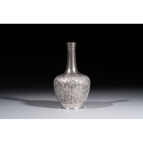 294 - A Chinese Canton or Vietnamese silver bottle vase with landscape design and six cups, 19th C.H.: 12 ... 