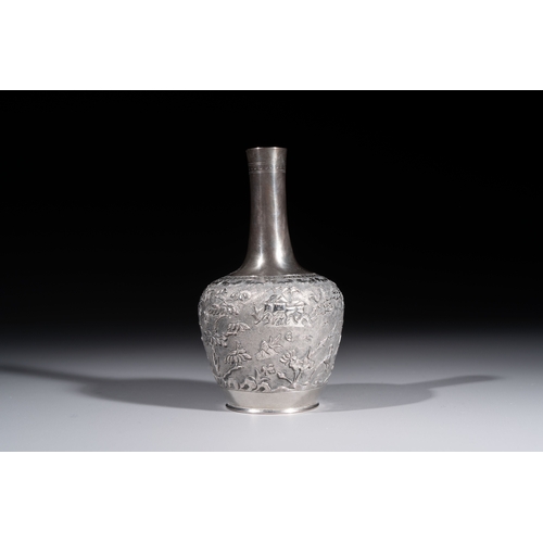 294 - A Chinese Canton or Vietnamese silver bottle vase with landscape design and six cups, 19th C.H.: 12 ... 