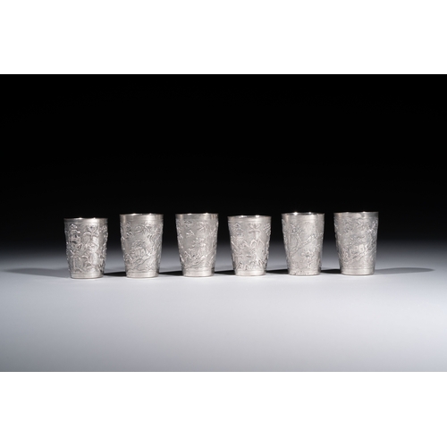 294 - A Chinese Canton or Vietnamese silver bottle vase with landscape design and six cups, 19th C.H.: 12 ... 