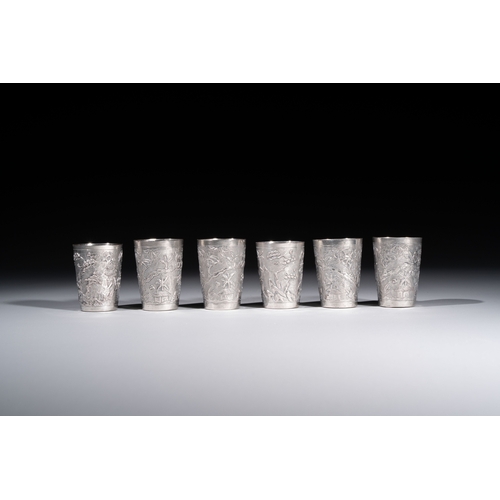 294 - A Chinese Canton or Vietnamese silver bottle vase with landscape design and six cups, 19th C.H.: 12 ... 