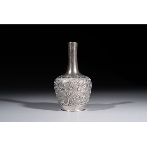 294 - A Chinese Canton or Vietnamese silver bottle vase with landscape design and six cups, 19th C.H.: 12 ... 