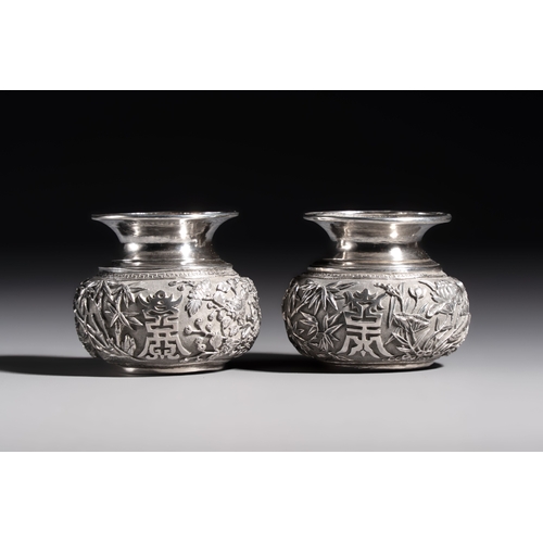 296 - A pair of Chinese silver jarlets, a pair of saucer dishes, a rectangular casket and a cylindrical bo... 