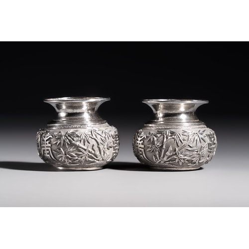 296 - A pair of Chinese silver jarlets, a pair of saucer dishes, a rectangular casket and a cylindrical bo... 