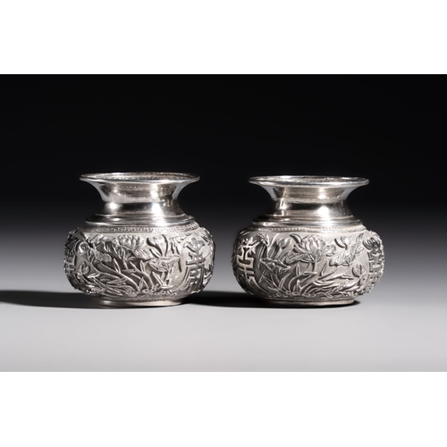 296 - A pair of Chinese silver jarlets, a pair of saucer dishes, a rectangular casket and a cylindrical bo... 