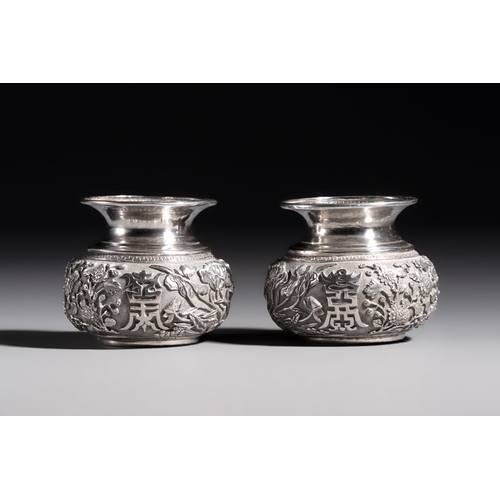 296 - A pair of Chinese silver jarlets, a pair of saucer dishes, a rectangular casket and a cylindrical bo... 