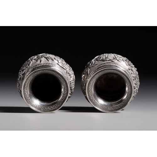 296 - A pair of Chinese silver jarlets, a pair of saucer dishes, a rectangular casket and a cylindrical bo... 