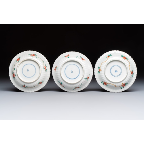 26 - Four Chinese famille verte cups and seven saucers, 19th C.Dia.: 12,5 cm (the saucers)Dia.: 7,9 cm - ... 