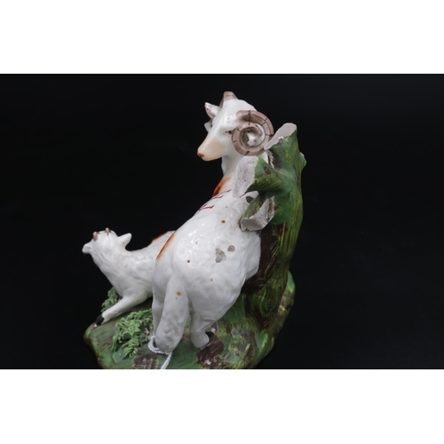 1 - A pair of 19th Century Royal Staffordshire figurines, 1 x Ram and 1 x Scottish Flatback, both figure... 