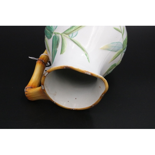 201 - Victorian Majolica Minton Jug with bamboo handle and leaf decoration, impressed mark Minton on the b... 