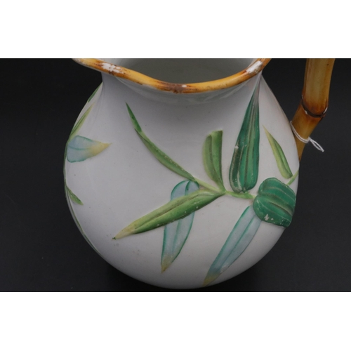 201 - Victorian Majolica Minton Jug with bamboo handle and leaf decoration, impressed mark Minton on the b... 