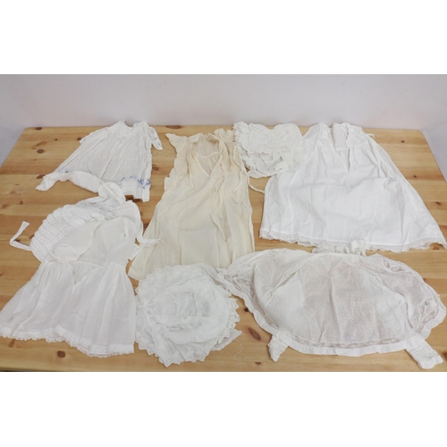 216 - A large collection of lace baby clothes (19th Century, Early) all wrapped in tissue paper.