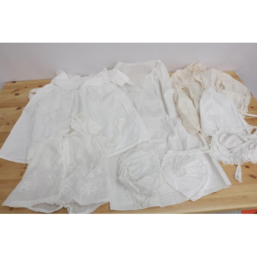 216 - A large collection of lace baby clothes (19th Century, Early) all wrapped in tissue paper.