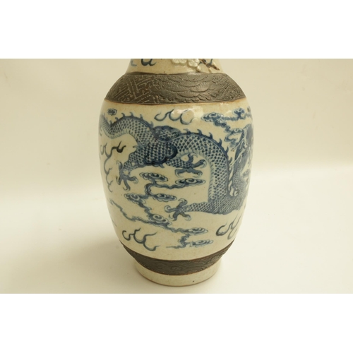 222 - Blue & White Glazed Chinese Vase decorated with dragons and raised flowers. Dimensions approx 18