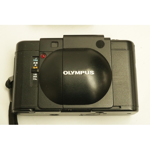 224 - Olympus XA with A16 Flash Camera. The XA is one of the smallest range finder cameras ever made. All ... 