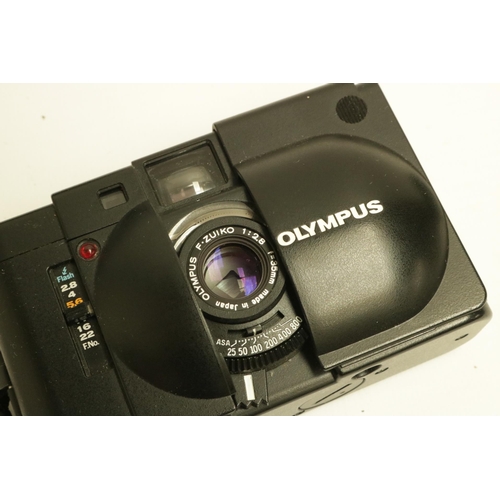 224 - Olympus XA with A16 Flash Camera. The XA is one of the smallest range finder cameras ever made. All ... 