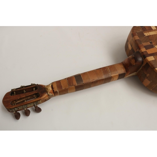 229 - A Wooden Guitar by famous sculptor and artist Maxie Lane. The item remains in great condition, and i... 