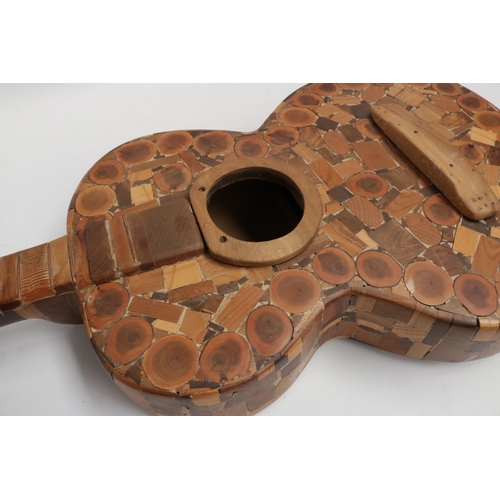 229 - A Wooden Guitar by famous sculptor and artist Maxie Lane. The item remains in great condition, and i... 