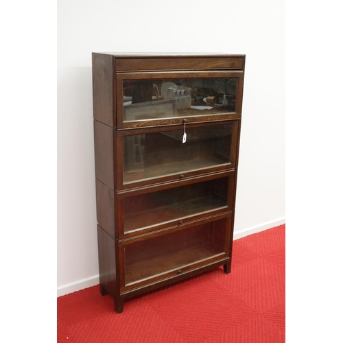 285 - Lovely vintage stacking oak & glass bookcase by Angus, with their motif inside.