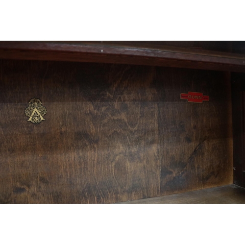 285 - Lovely vintage stacking oak & glass bookcase by Angus, with their motif inside.