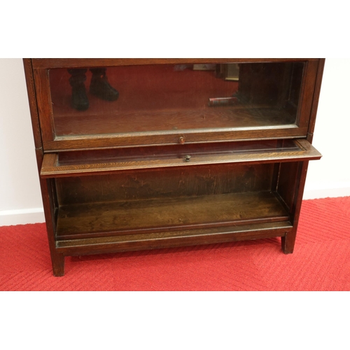 285 - Lovely vintage stacking oak & glass bookcase by Angus, with their motif inside.