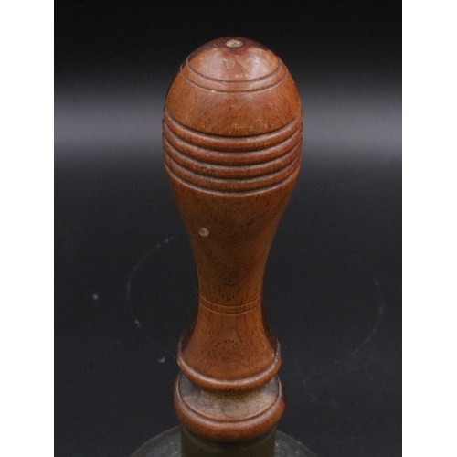 343 - A vintage handheld bell with with wooden handle. (11 inches)