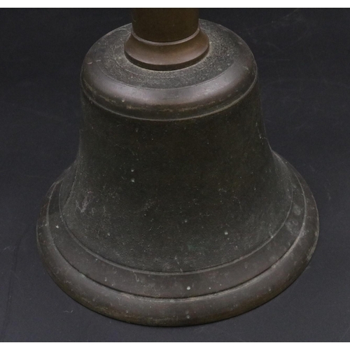 343 - A vintage handheld bell with with wooden handle. (11 inches)