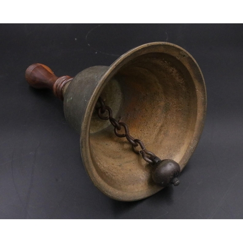 343 - A vintage handheld bell with with wooden handle. (11 inches)