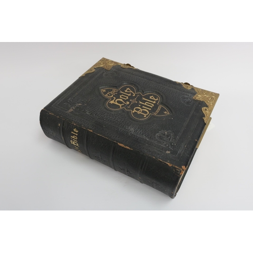 36 - An 1890 Leather and Brass Bible with an abridgement of the commentaries of Scott & Henry. All conden... 