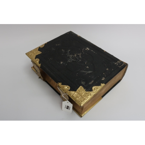 36 - An 1890 Leather and Brass Bible with an abridgement of the commentaries of Scott & Henry. All conden... 