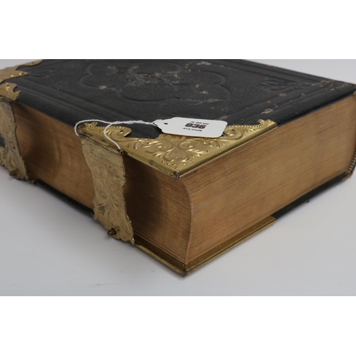 36 - An 1890 Leather and Brass Bible with an abridgement of the commentaries of Scott & Henry. All conden... 