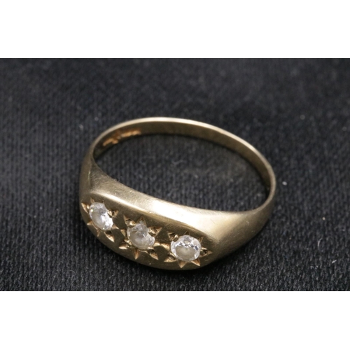 95 - 9CT Gold Ring Set with 3 Clear Stones which do not test as diamond. Over all weight 3.2grams