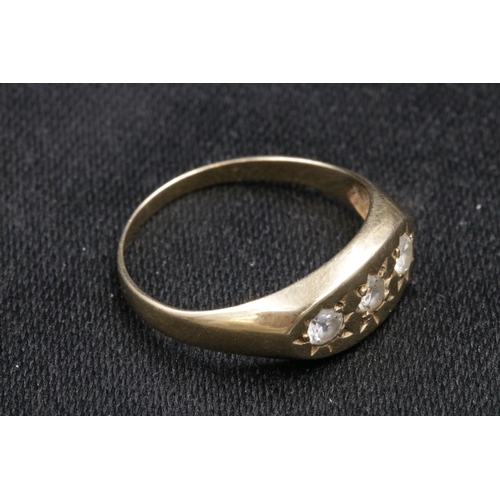 95 - 9CT Gold Ring Set with 3 Clear Stones which do not test as diamond. Over all weight 3.2grams