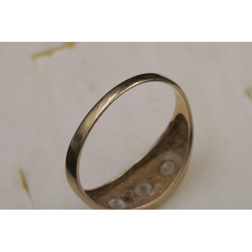 95 - 9CT Gold Ring Set with 3 Clear Stones which do not test as diamond. Over all weight 3.2grams