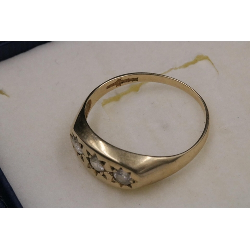 95 - 9CT Gold Ring Set with 3 Clear Stones which do not test as diamond. Over all weight 3.2grams