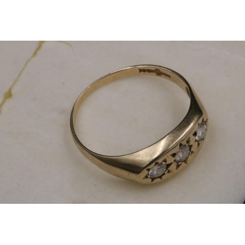 95 - 9CT Gold Ring Set with 3 Clear Stones which do not test as diamond. Over all weight 3.2grams