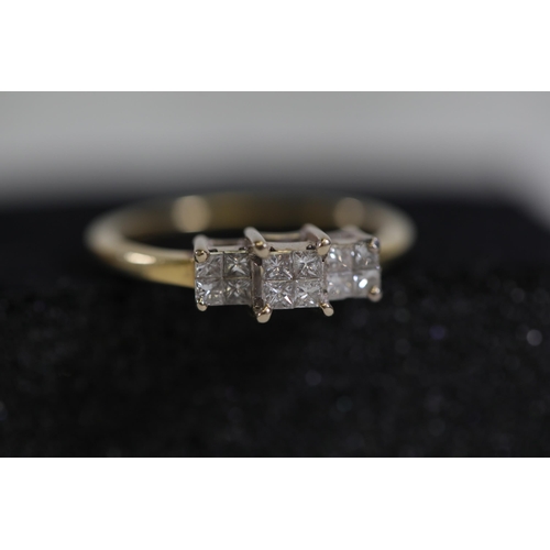 109 - A three stone Princess cut diamond ring, Cathedral set in 18ct yellow gold, ring size S