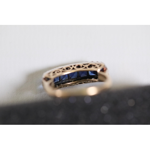 110 - A pave set sapphire & diamond ring set in 14ct yellow gold. Ring size K - L (this item has no hallma... 