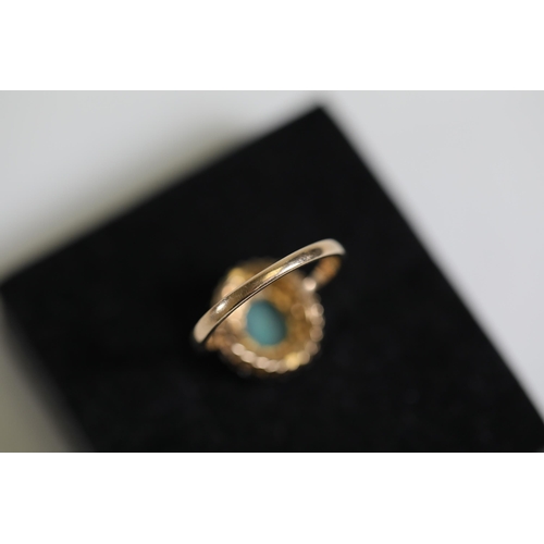 114 - A Oval Opal & diamond cluster ring, set in 9ct yellow gold Ring size P (this item has no hallmarks p... 