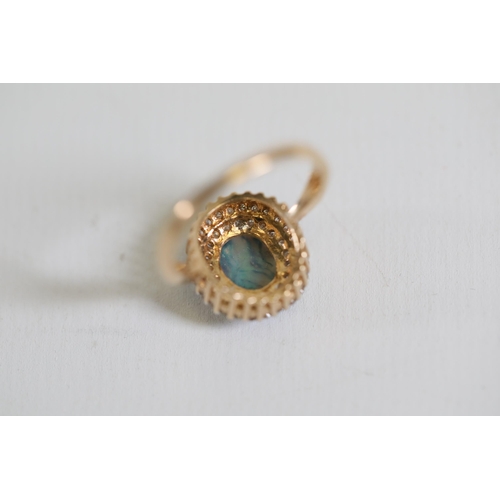 114 - A Oval Opal & diamond cluster ring, set in 9ct yellow gold Ring size P (this item has no hallmarks p... 