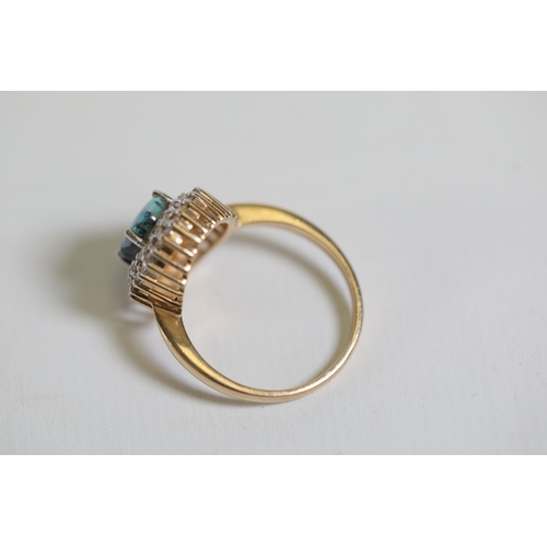 114 - A Oval Opal & diamond cluster ring, set in 9ct yellow gold Ring size P (this item has no hallmarks p... 