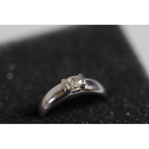 116 - A 0.5 diamond solitaire ring, set in rub over setting, in 18ct white gold, ring size N-O