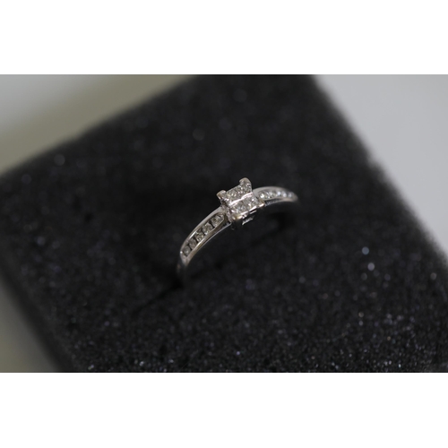 123 - 0.75 diamond solitaire claw set ring with channel set diamond shoulders, in 18ct yellow gold, ring s... 