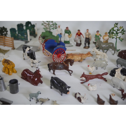 131 - Over 60 items of vintage Britain's lead farm animals, people and scenery