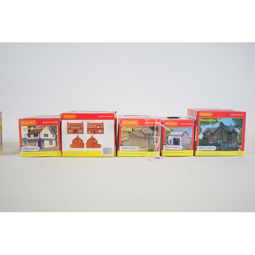 151 - Selection of Hornby cottages homes and shops 9 of which are boxed 2 shops do not have boxed the off ... 