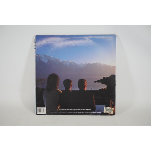 17 - Queen Made in heaven LP Vinyl Record 1995 Parlophone with its poster the record itself looks to be i... 