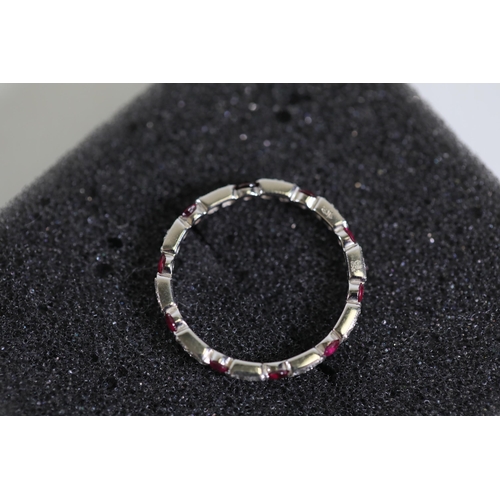 195 - Ruby and diamond full eternity ring set in 18ct white gold Size is between N and O